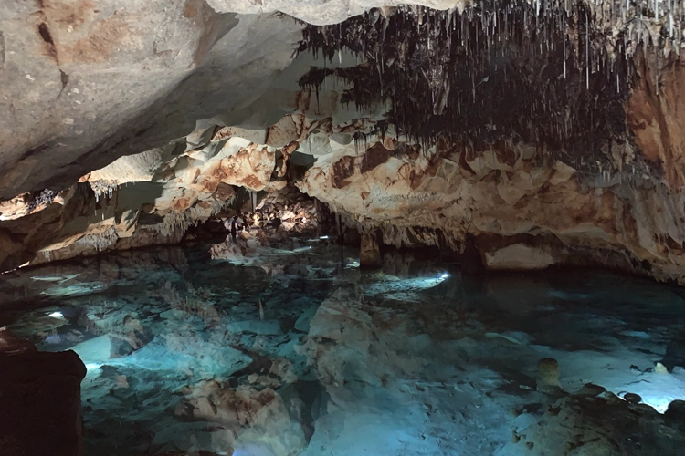 Underground lake in cave system at Cova de s’Aigua